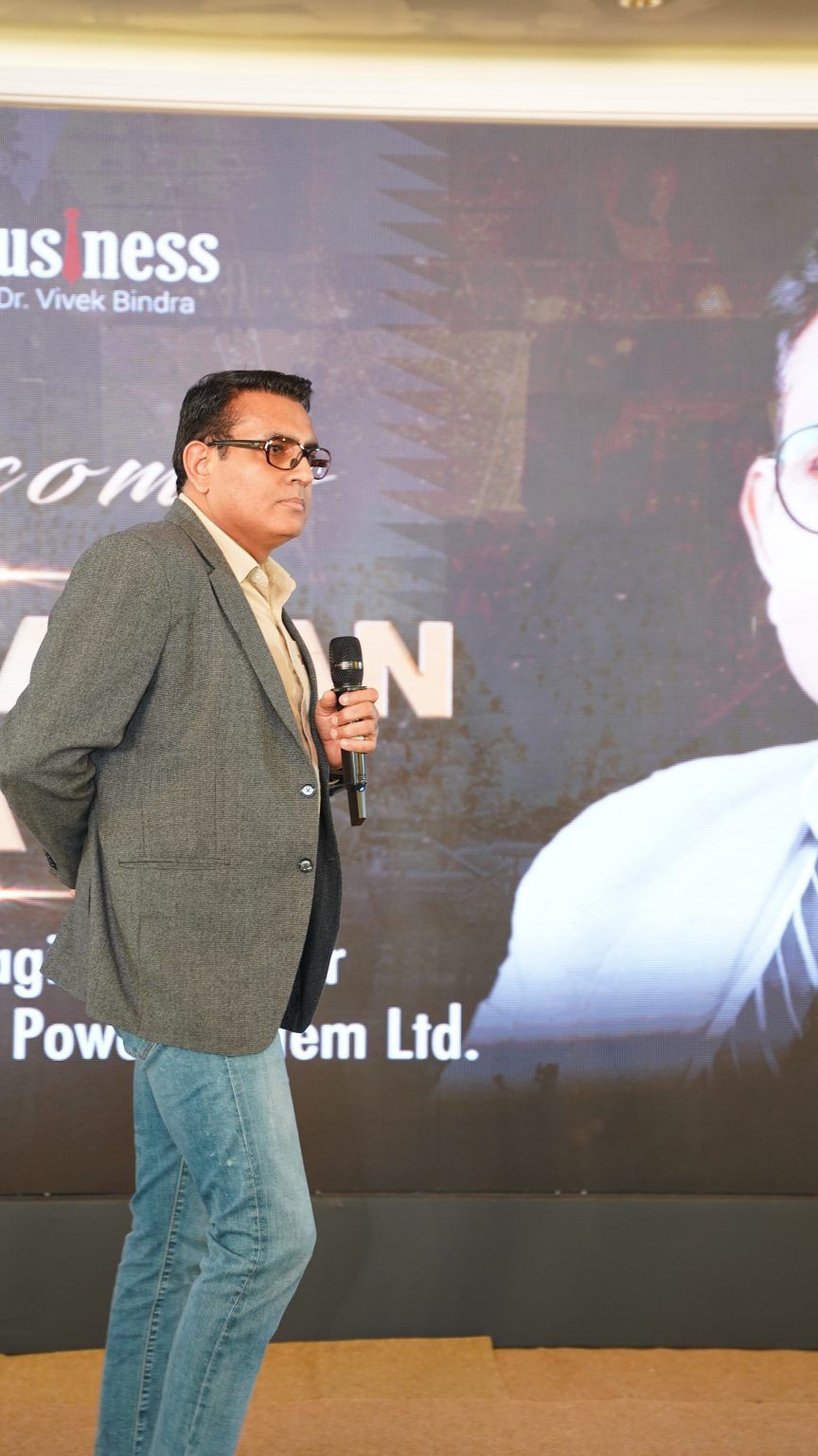 Raman Bhatia speaking on stage